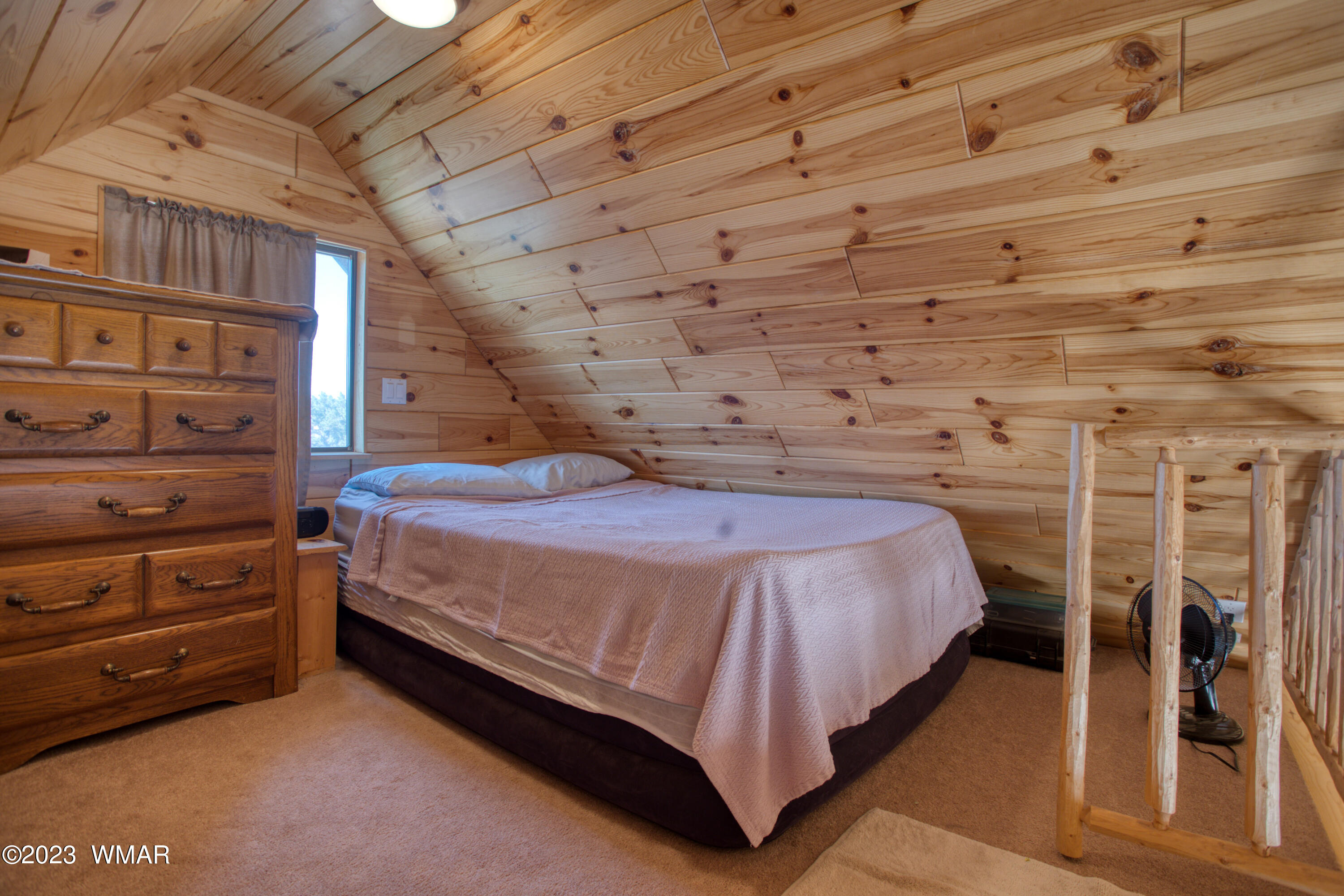 4558 Stirrup Road Snowflake, AZ 85937 - Photo 8 of 16 a bed sitting in a bedroom next to a window