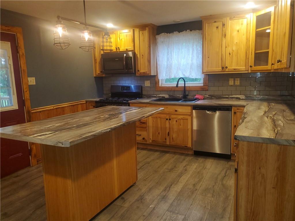 132 Laird's Crossing Road Worthington, PA 16262 - Photo 10 of 20 a kitchen with stainless steel appliances granite countertop wooden cabinets a oven a sink and dishwasher