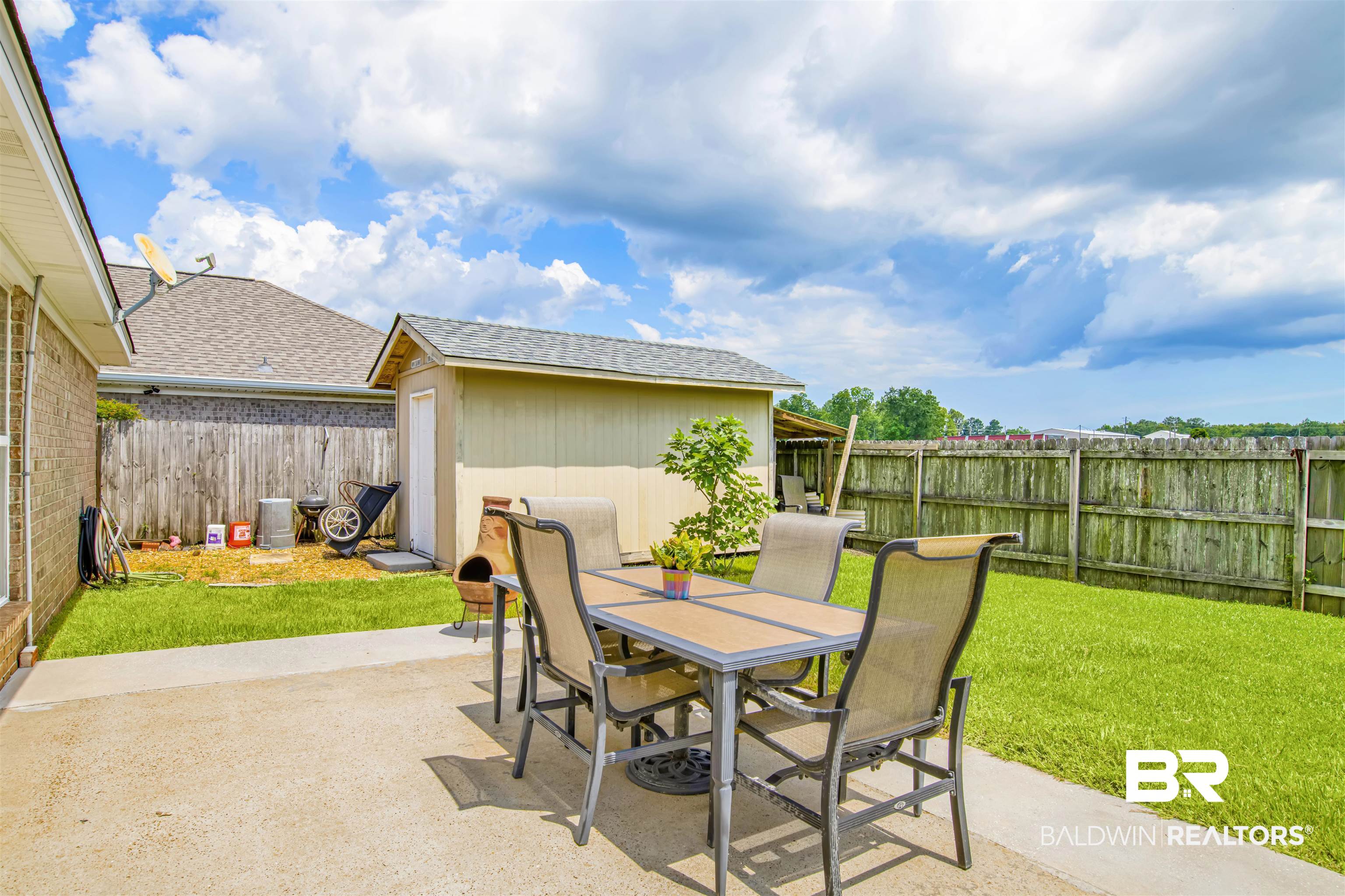 1044 Amazon Drive Foley, AL 36535 - Photo 26 of 29 View of patio featuring an outbuilding