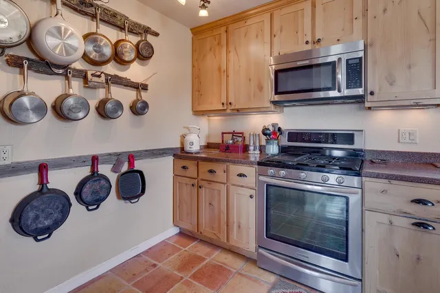 a kitchen with a stove and a microwave