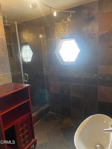 a view of a livingroom with wooden floor and window