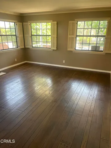 a view of a livingroom with wooden floor