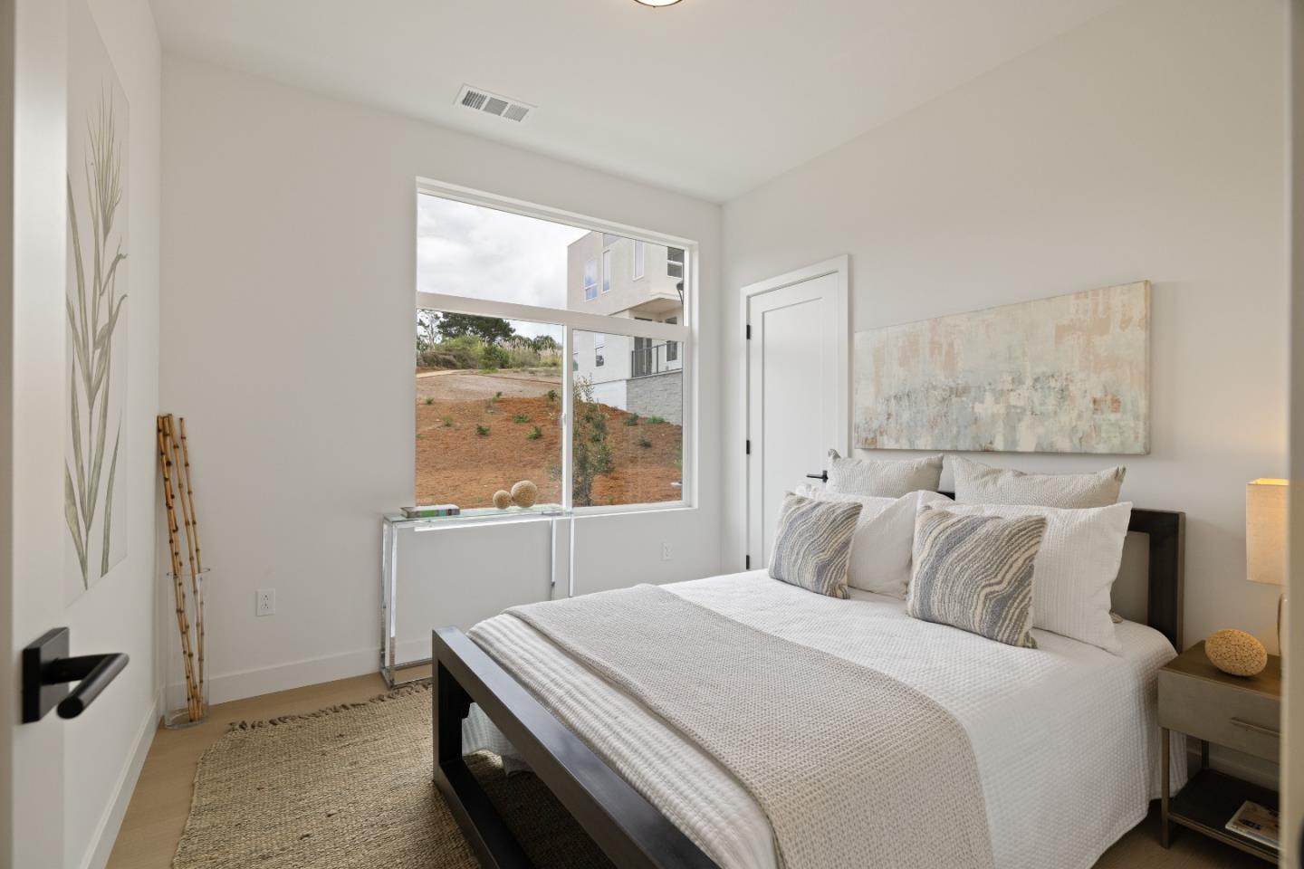 823 Fassler, Unit 823 Pacifica, CA 94044 - Photo 16 of 37 a bedroom with a bed and a window