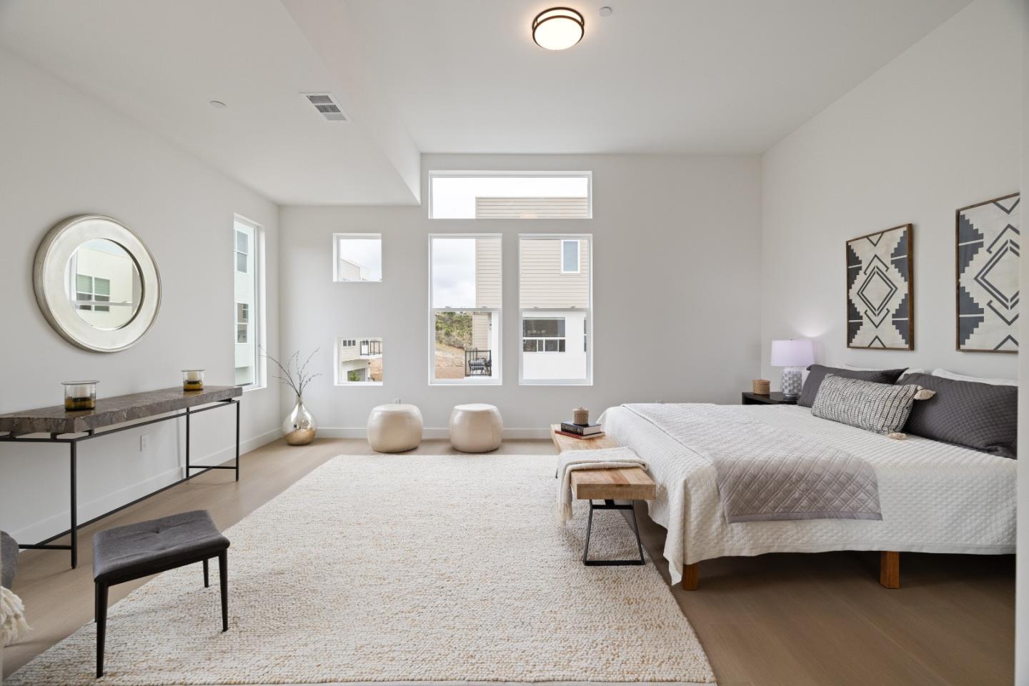 823 Fassler, Unit 823 Pacifica, CA 94044 - Photo 19 of 37 a bedroom with a bed a dresser and chair