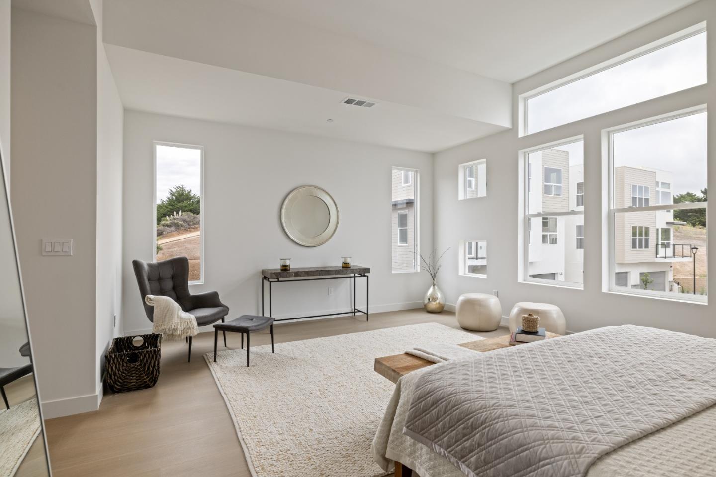 823 Fassler, Unit 823 Pacifica, CA 94044 - Photo 20 of 37 a bedroom with a bed furniture and a large window