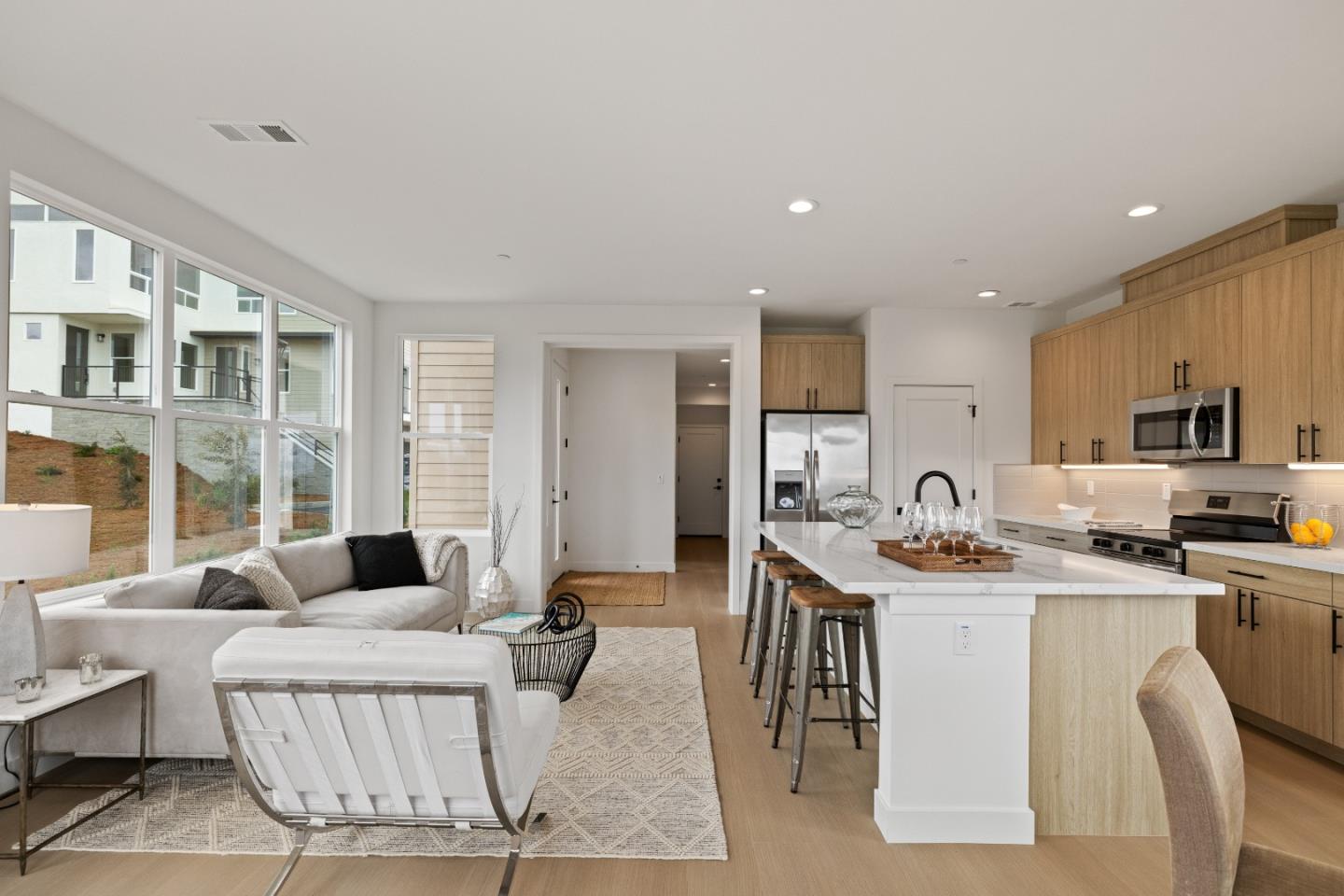 823 Fassler, Unit 823 Pacifica, CA 94044 - Photo 6 of 37 a living room with stainless steel appliances kitchen island granite countertop a stove a sink a dining table and chairs