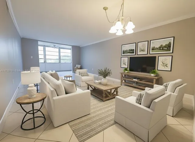 a living room with furniture a flat screen tv and a window