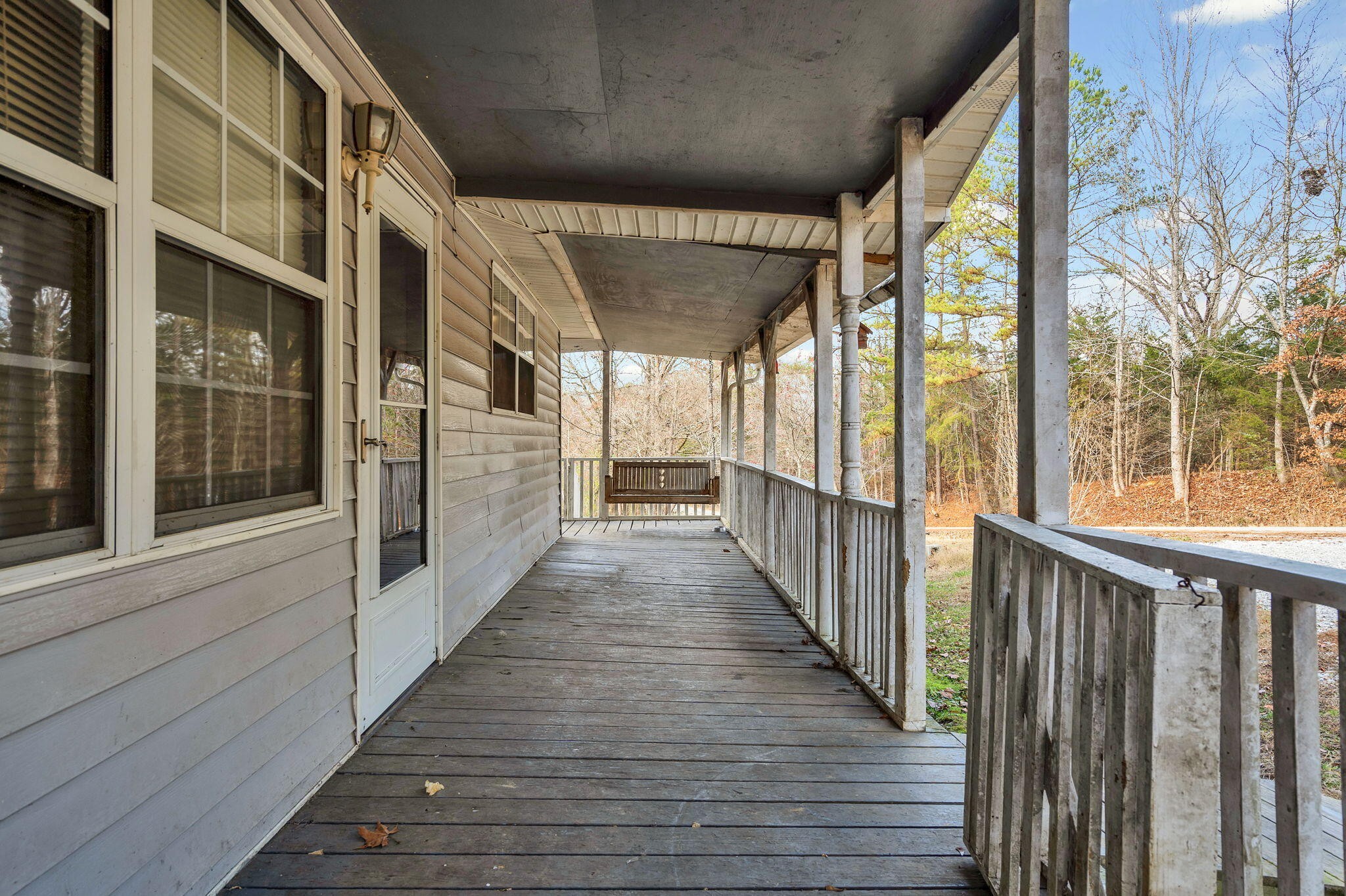 1895 North Hunter Bend Road Decatur, TN 37322 - Photo 16 of 33 a view of a porch with wooden floor and stairs