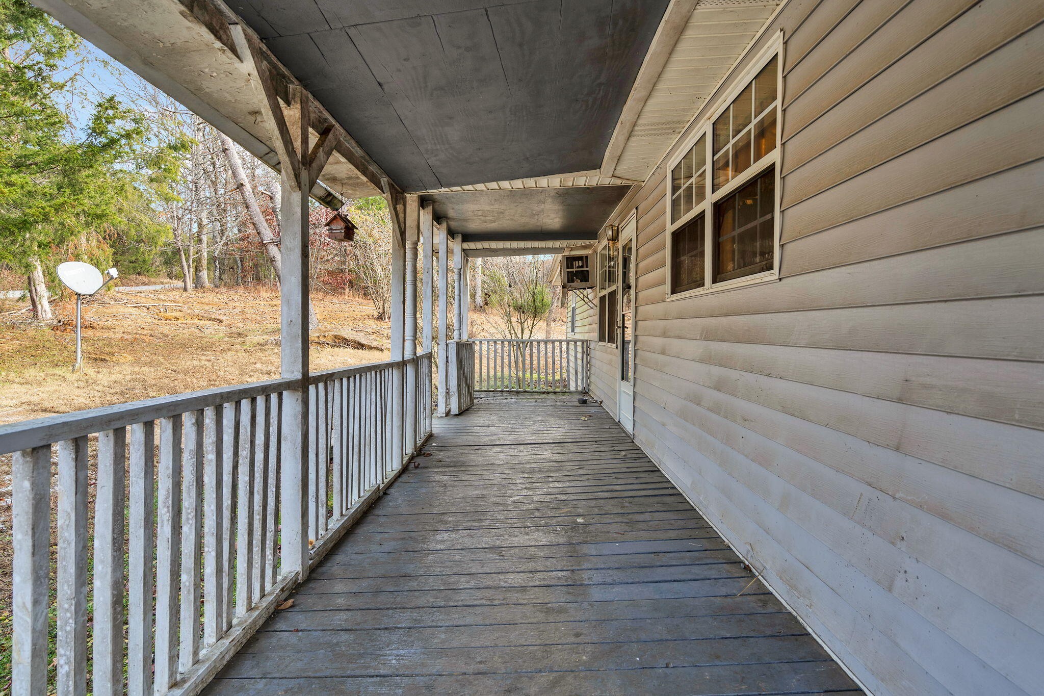 1895 North Hunter Bend Road Decatur, TN 37322 - Photo 17 of 33 a view of a porch with wooden floor and windows