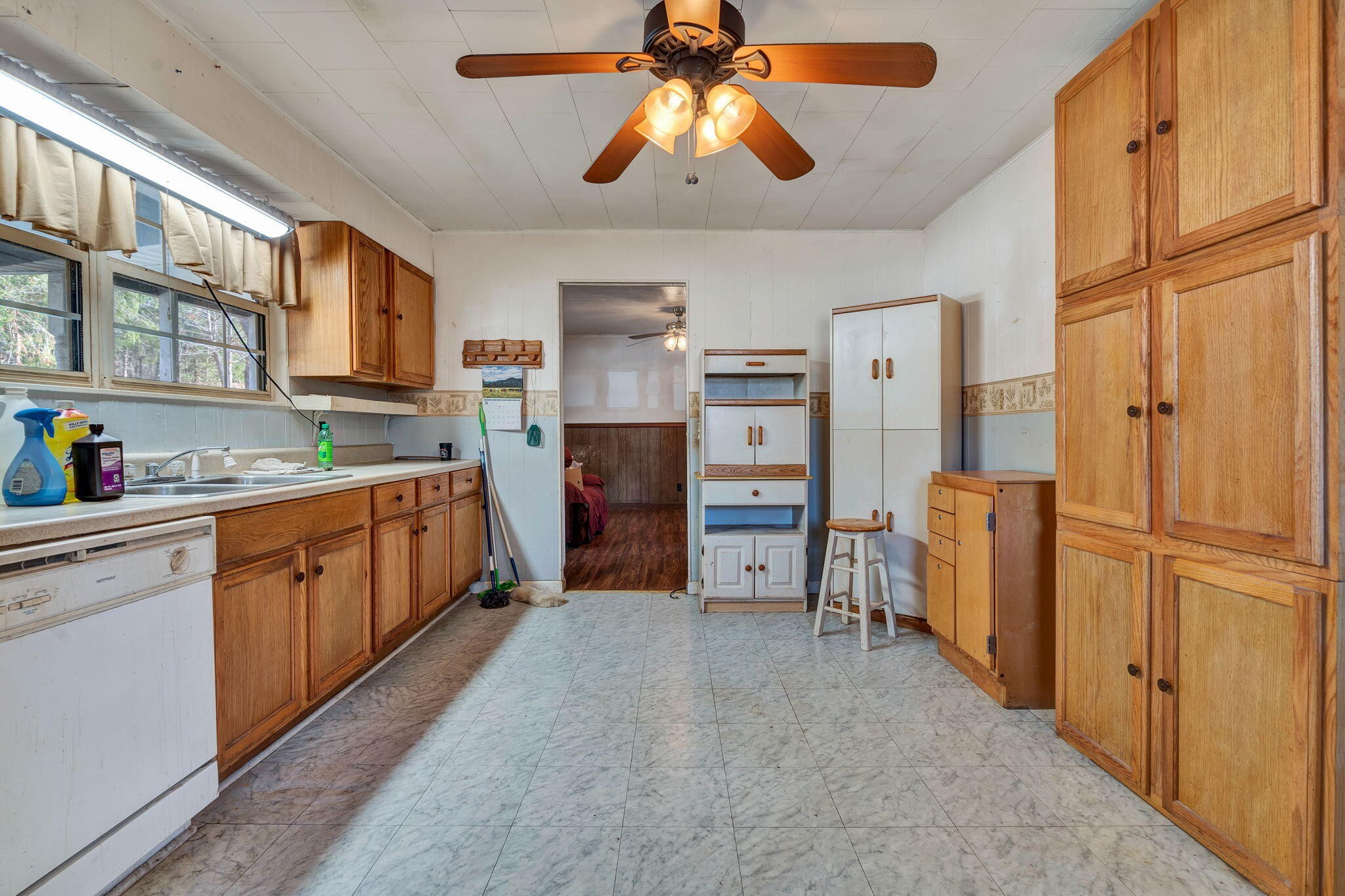 1895 North Hunter Bend Road Decatur, TN 37322 - Photo 6 of 33 a kitchen with cabinets and wooden floor