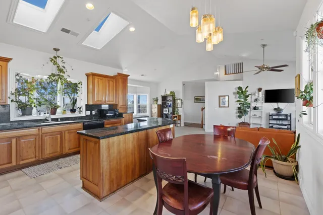 a dining table with chairs and window