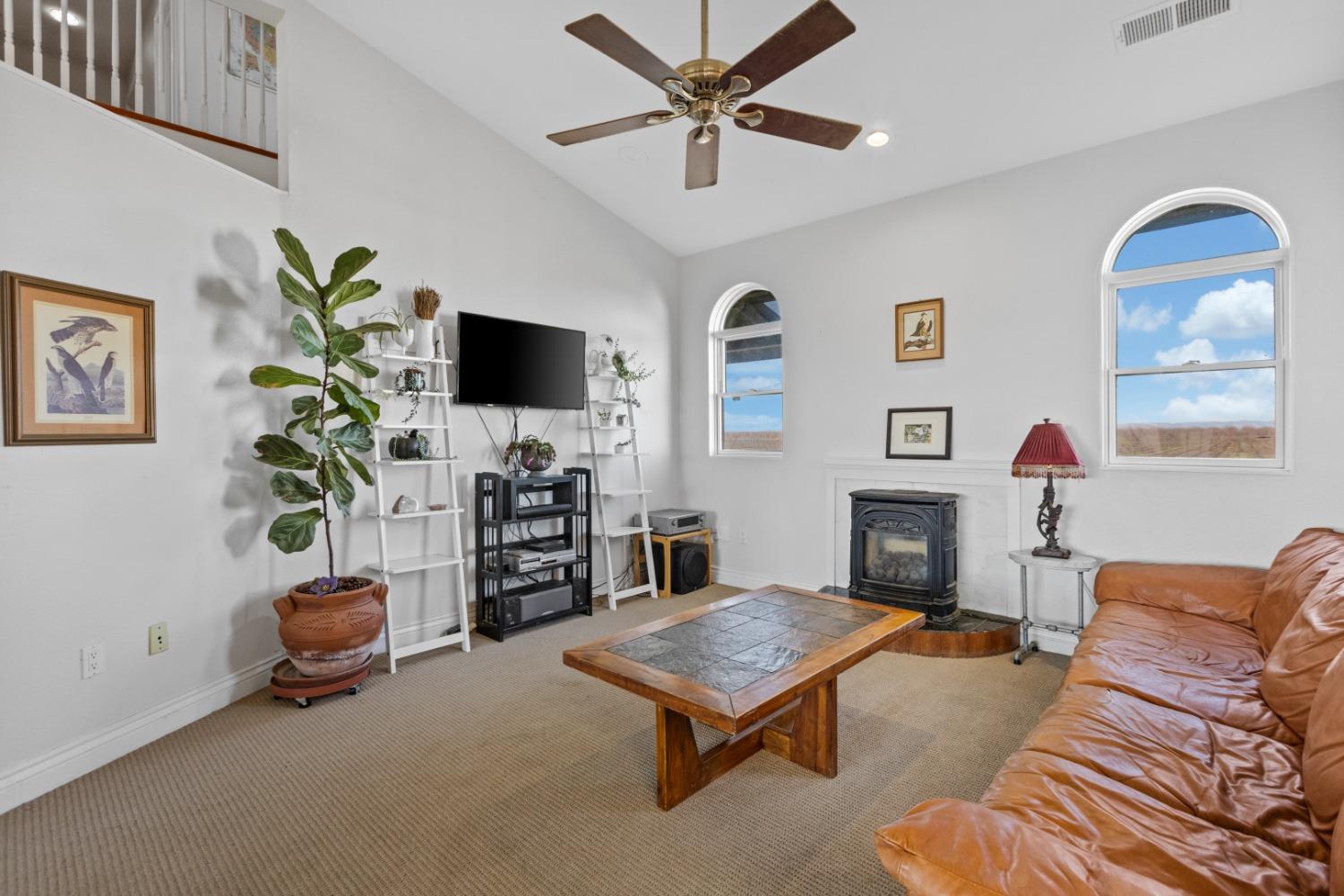 44643 County Road 29 Davis, CA 95618 - Photo 15 of 36 a living room with furniture a fireplace and a flat screen tv