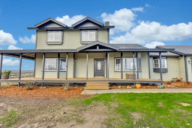 a front view of a house with garage