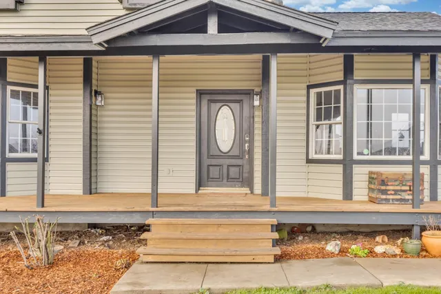 a front view of a house with a large window
