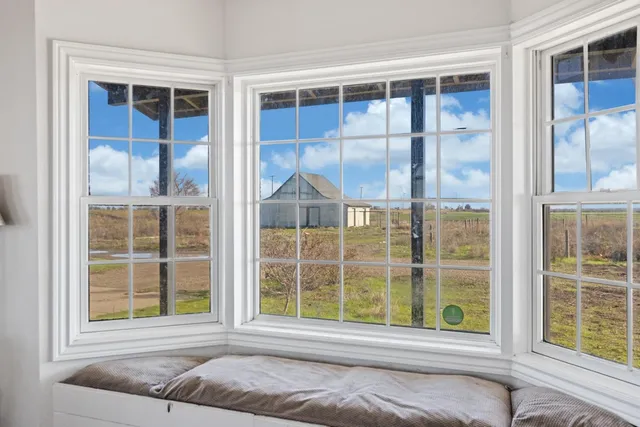 a view of a bedroom with a large window