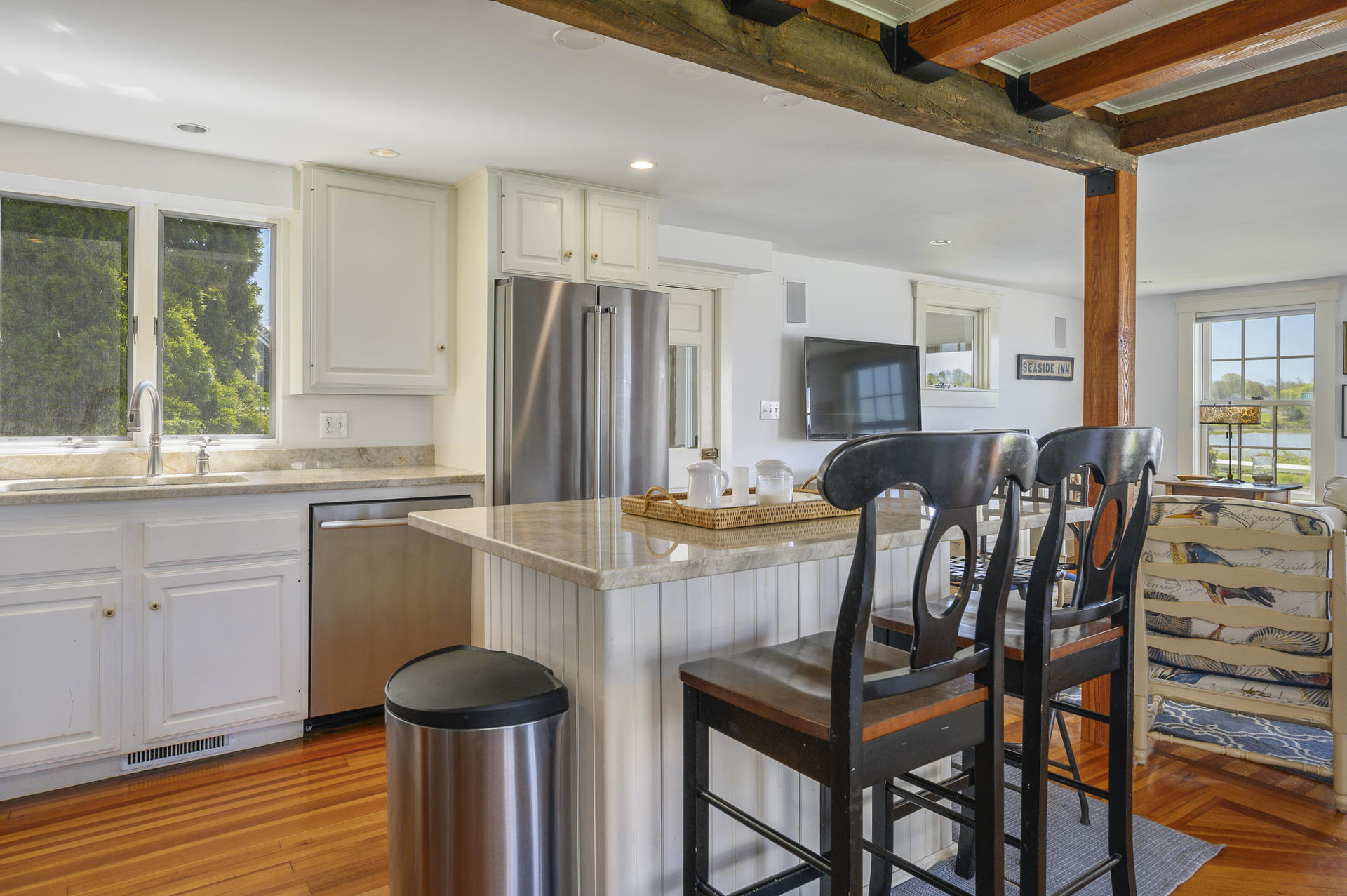 133 Queen Anne Road Chatham, MA 02633 - Photo 12 of 52 a view of kitchen with granite countertop cabinets table and chairs