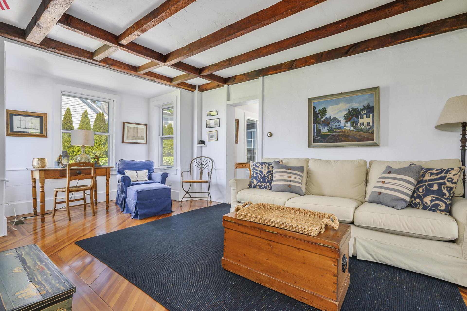 133 Queen Anne Road Chatham, MA 02633 - Photo 16 of 52 a living room with furniture a table and a painting on the wall