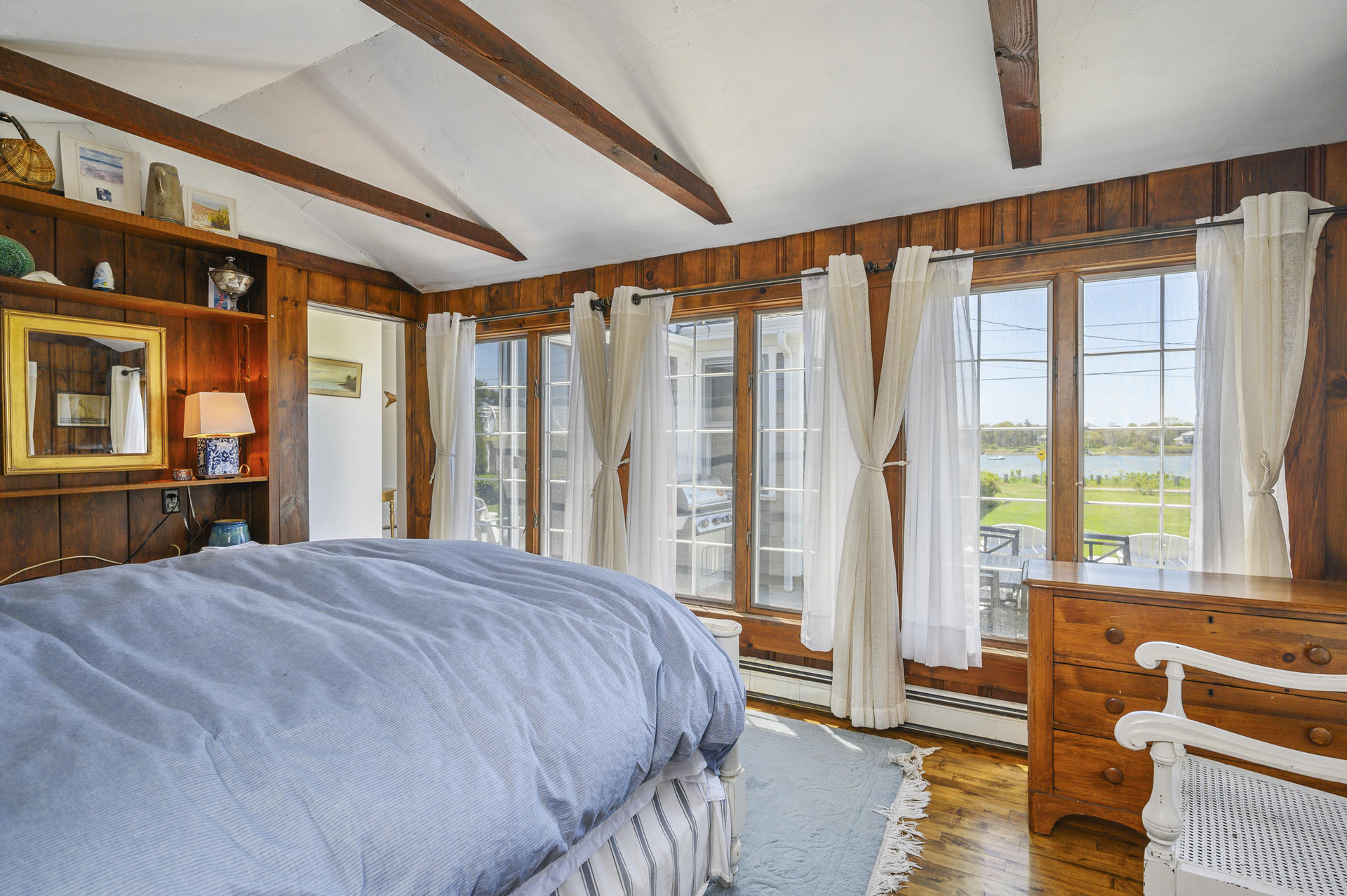 133 Queen Anne Road Chatham, MA 02633 - Photo 19 of 52 a bed sitting in a bedroom next to a window