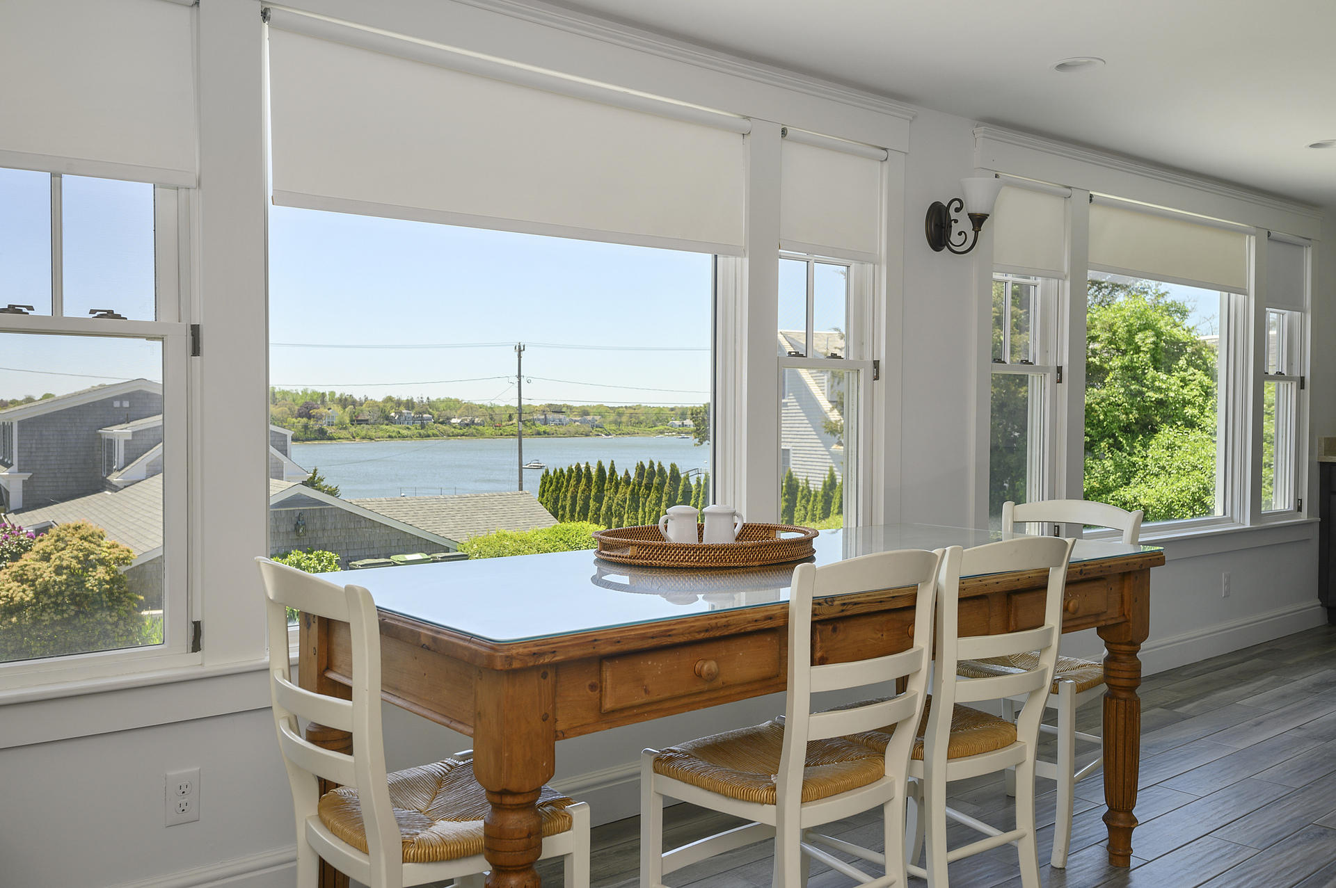 133 Queen Anne Road Chatham, MA 02633 - Photo 28 of 52 a dining room with furniture a chandelier and wooden floor