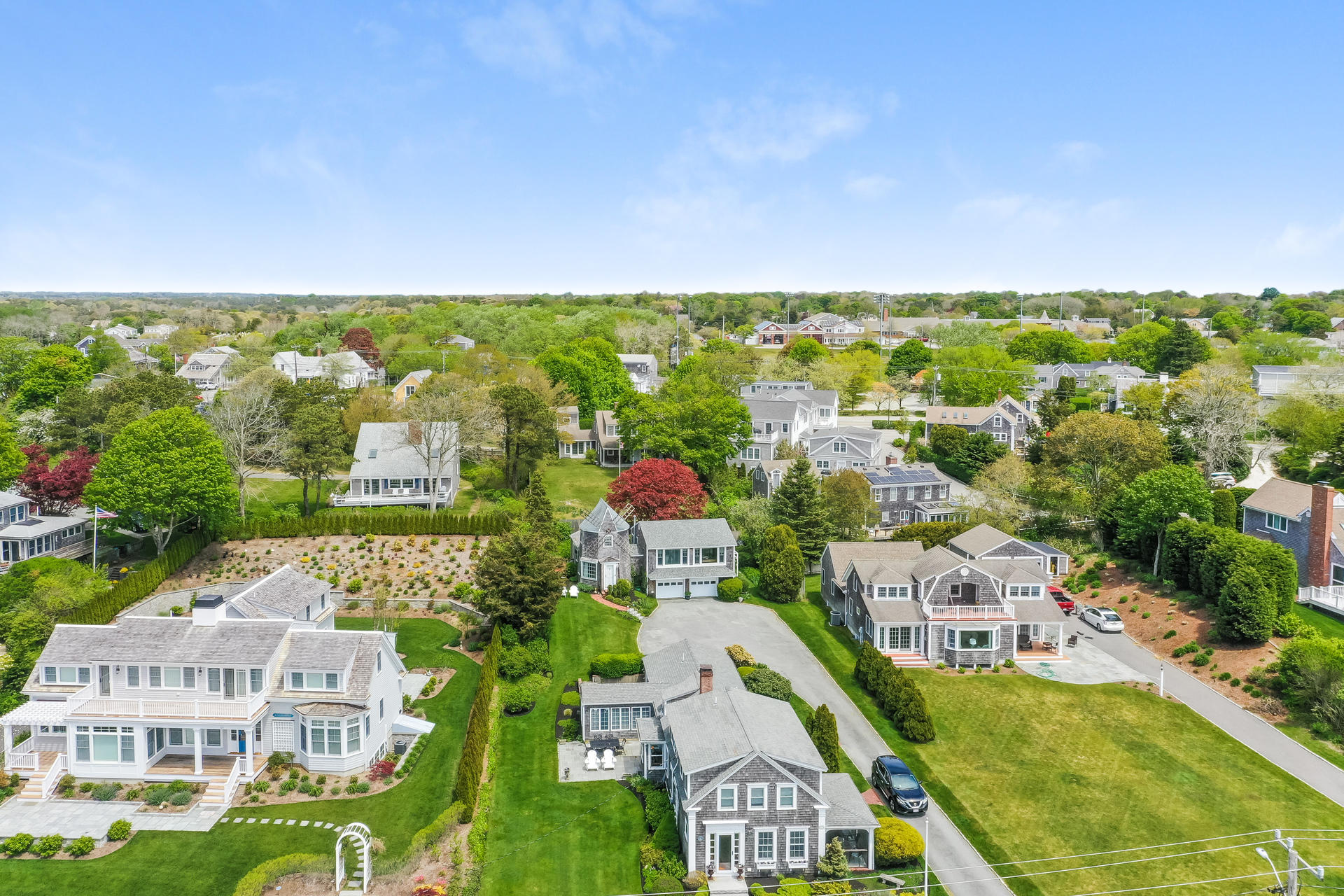 133 Queen Anne Road Chatham, MA 02633 - Photo 3 of 52 an aerial view of residential houses with outdoor space and trees