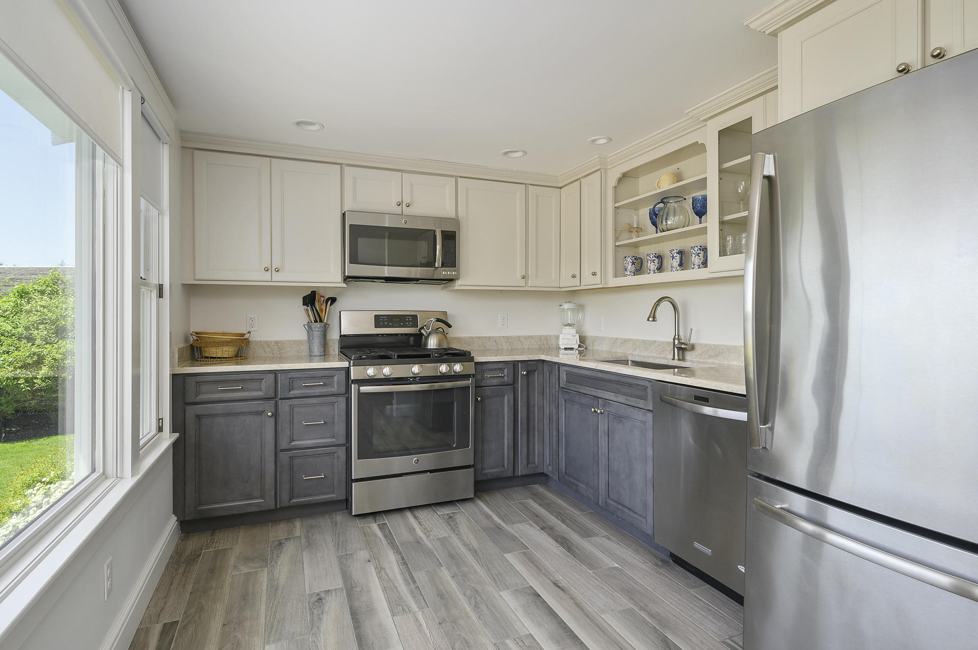 133 Queen Anne Road Chatham, MA 02633 - Photo 29 of 52 a kitchen with stainless steel appliances granite countertop a stove a sink and a refrigerator
