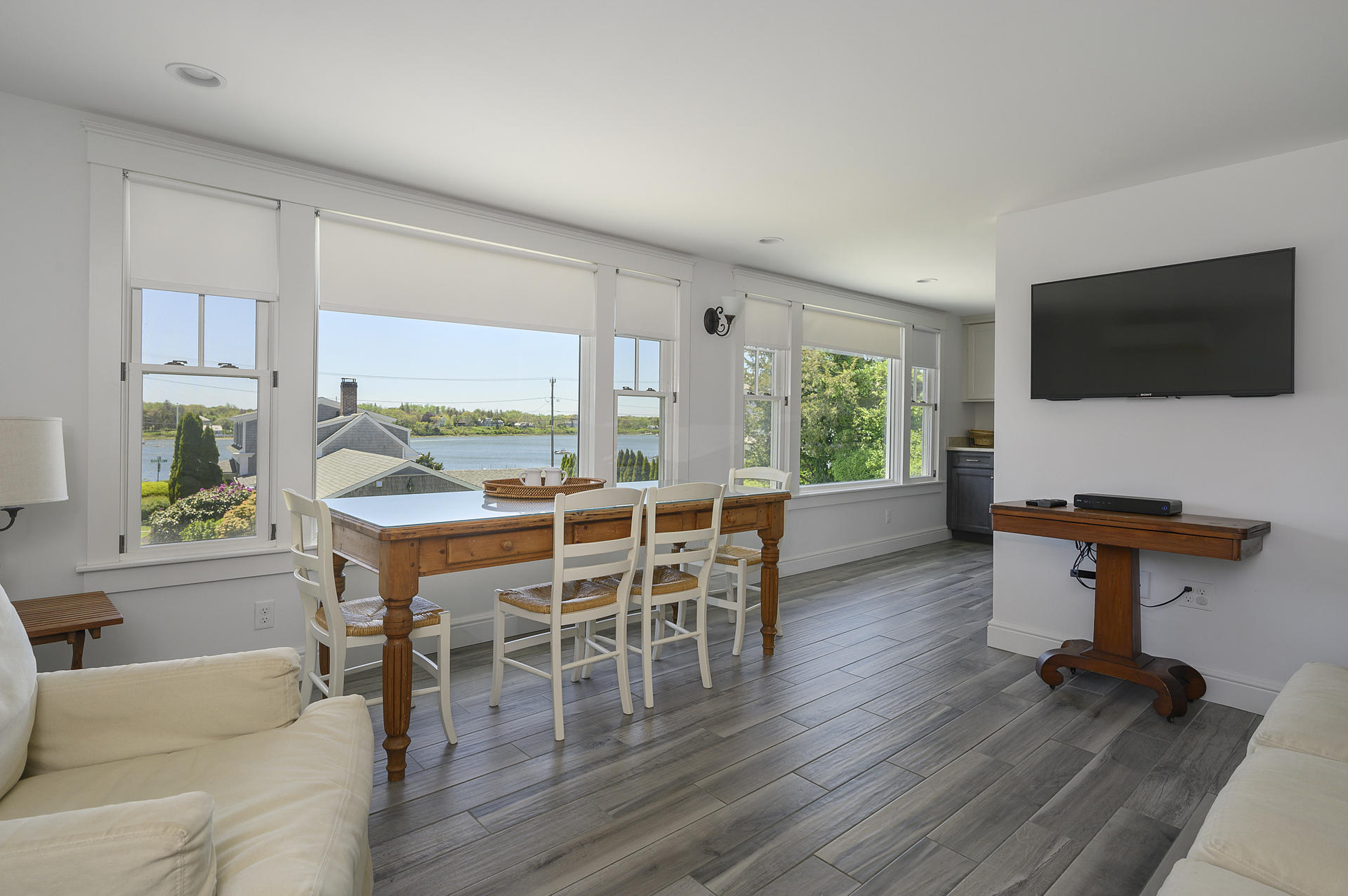 133 Queen Anne Road Chatham, MA 02633 - Photo 31 of 52 a dining room with furniture window and wooden floor