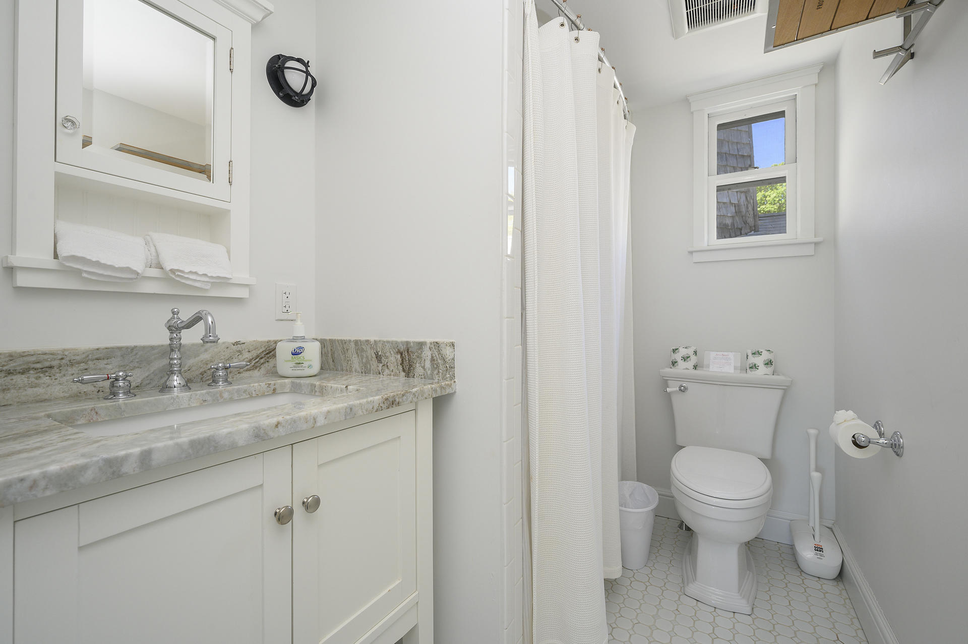 133 Queen Anne Road Chatham, MA 02633 - Photo 33 of 52 a bathroom with a granite countertop sink toilet and a mirror