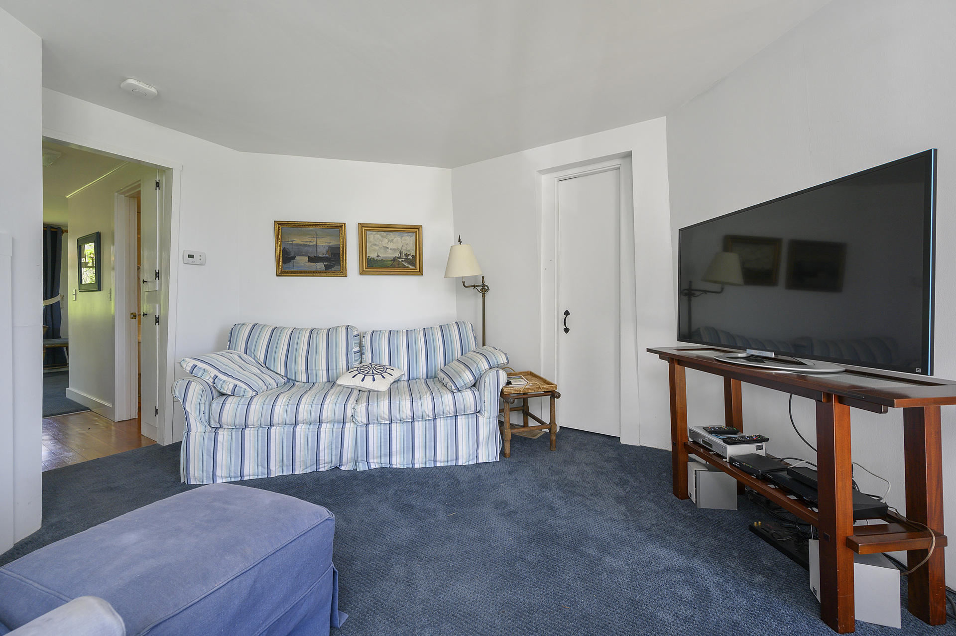 133 Queen Anne Road Chatham, MA 02633 - Photo 39 of 52 a living room with a baby crib furniture and a flat screen tv