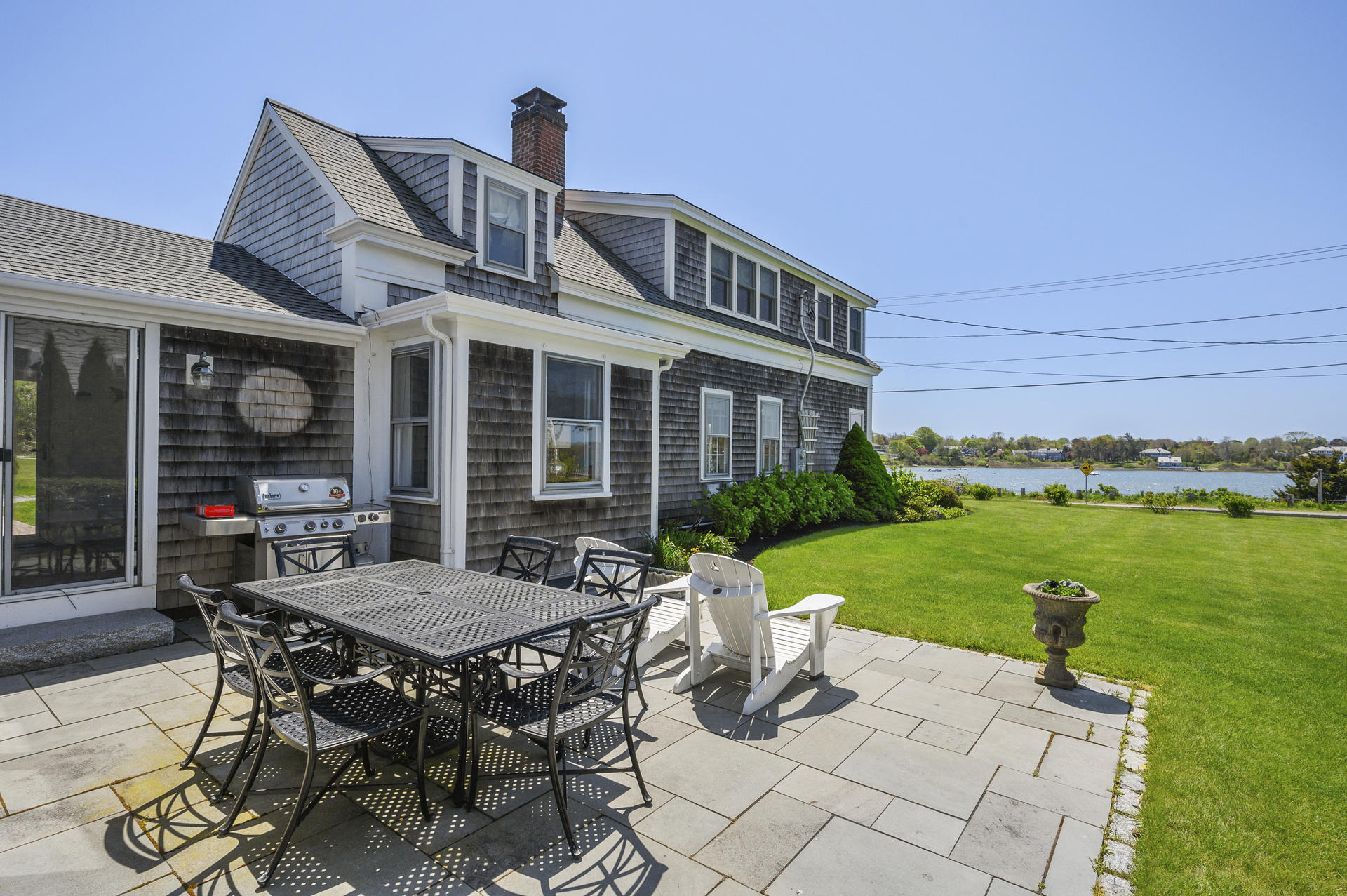 133 Queen Anne Road Chatham, MA 02633 - Photo 5 of 52 a view of a house with backyard sitting area and garden