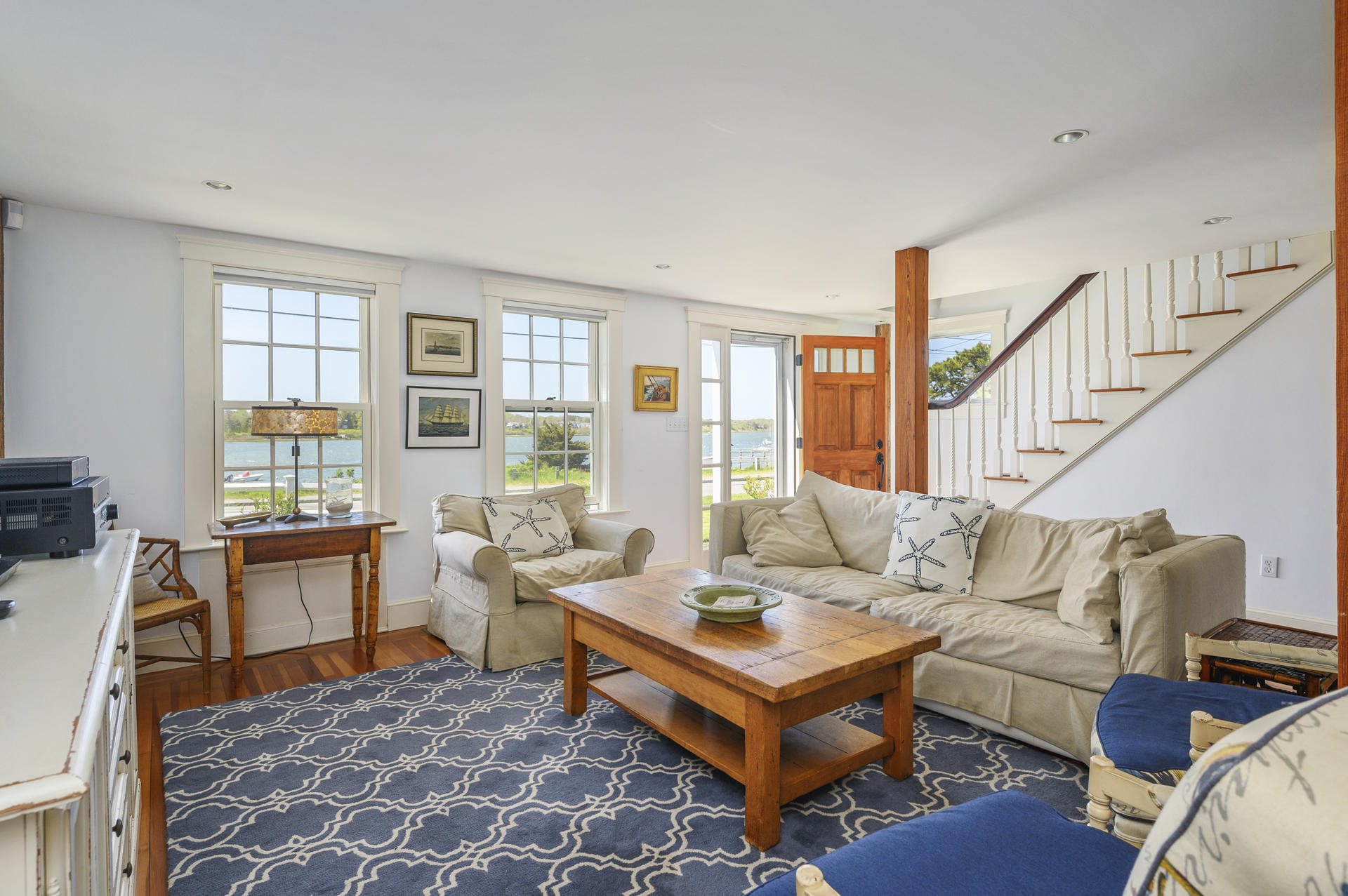 133 Queen Anne Road Chatham, MA 02633 - Photo 7 of 52 a living room with furniture a rug and a large window
