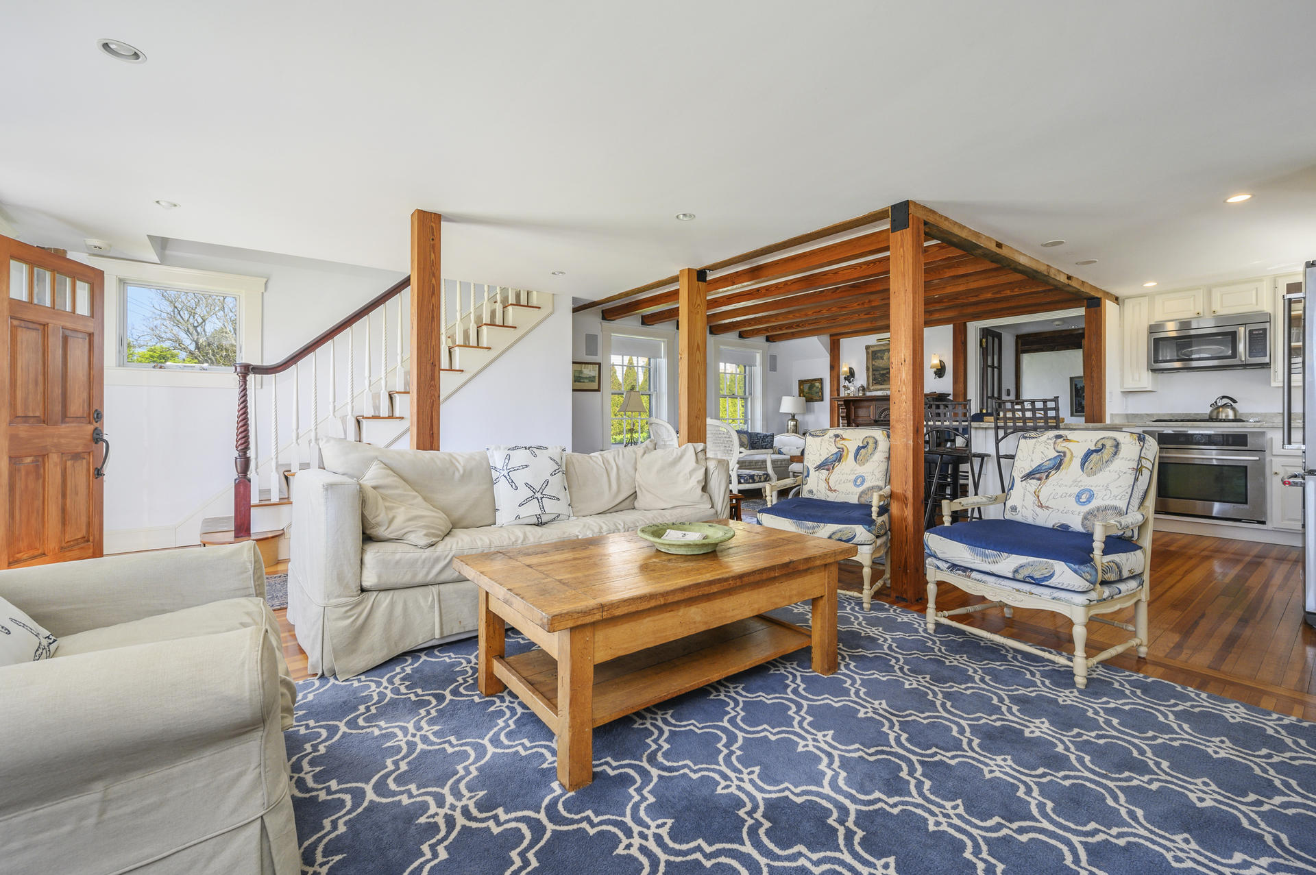 133 Queen Anne Road Chatham, MA 02633 - Photo 8 of 52 a living room with furniture a rug and white walls
