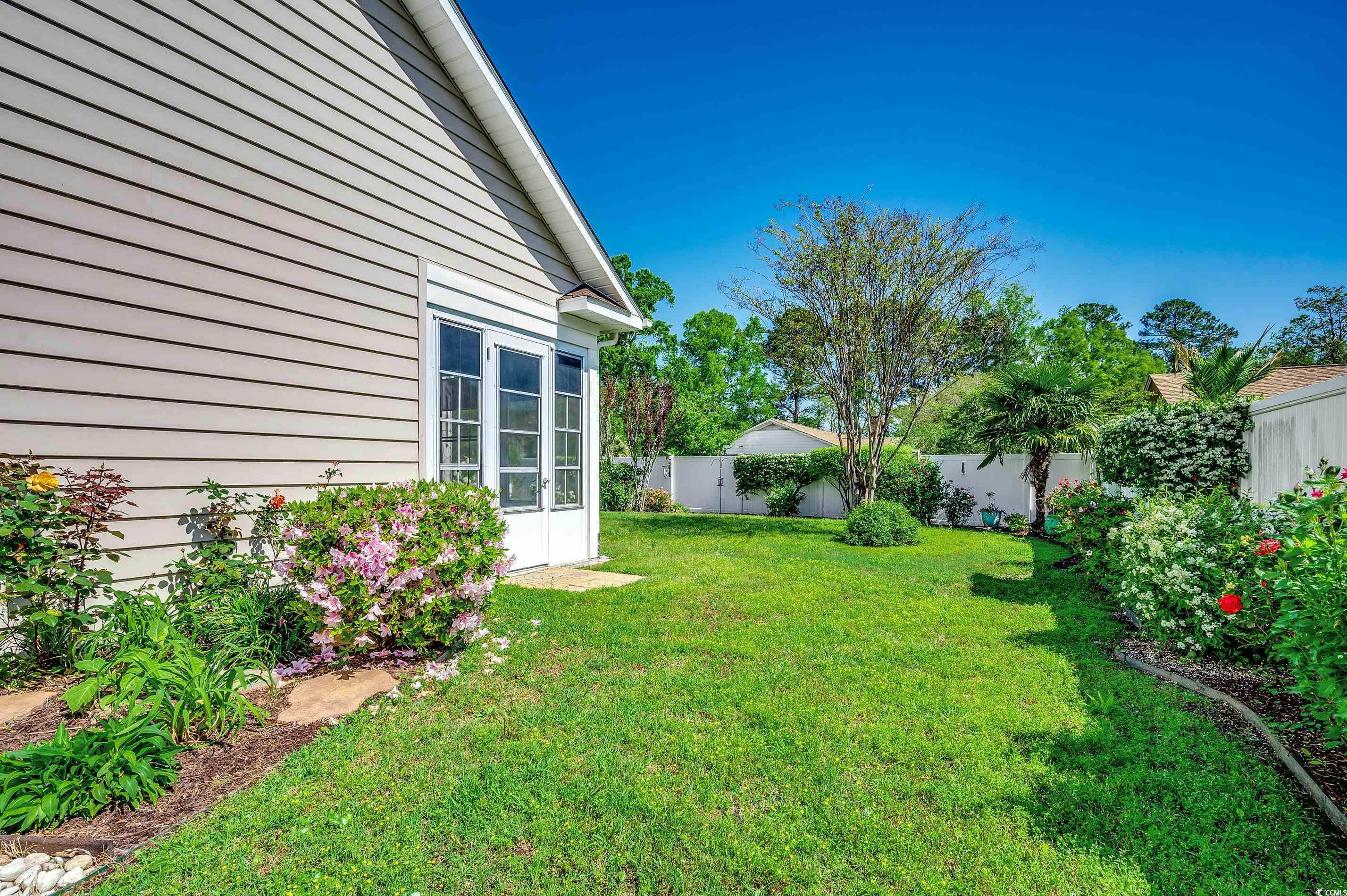 109 Pheasant Run Drive Murrells Inlet, SC 29576 - Photo 24 of 31 View of yard with a fenced backyard