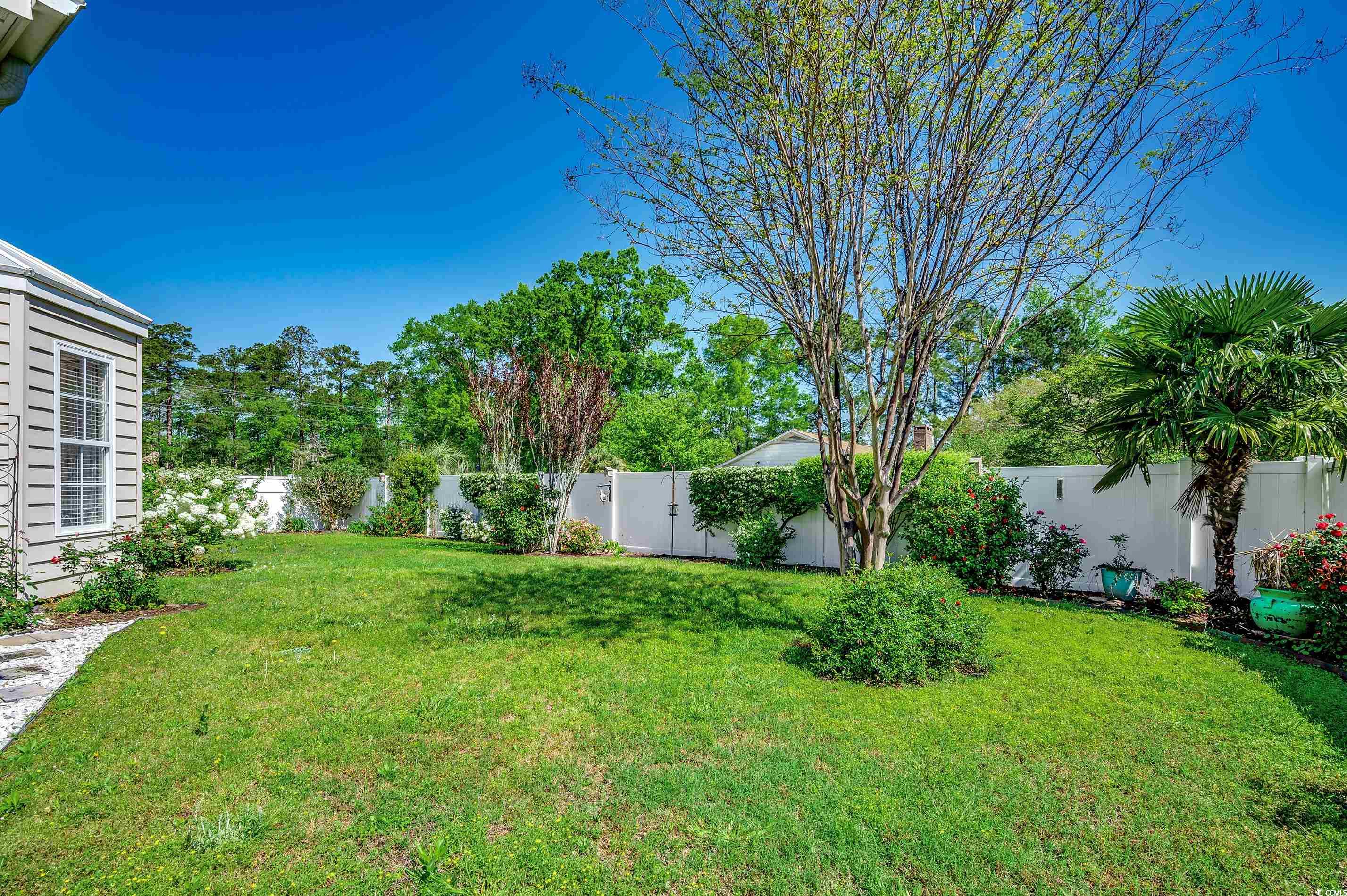 109 Pheasant Run Drive Murrells Inlet, SC 29576 - Photo 25 of 31 View of yard with a fenced backyard