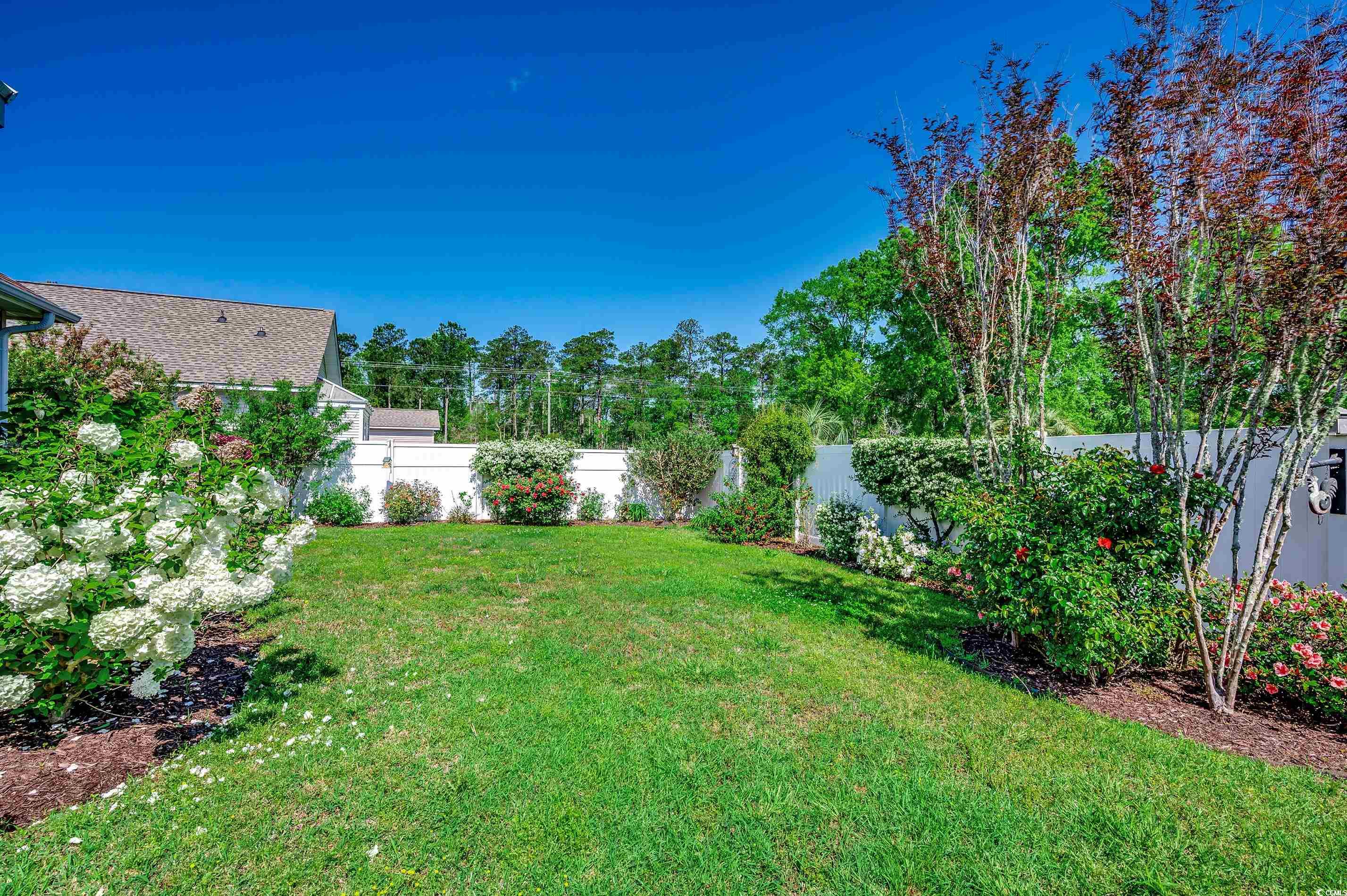 109 Pheasant Run Drive Murrells Inlet, SC 29576 - Photo 26 of 31 View of yard featuring a fenced backyard
