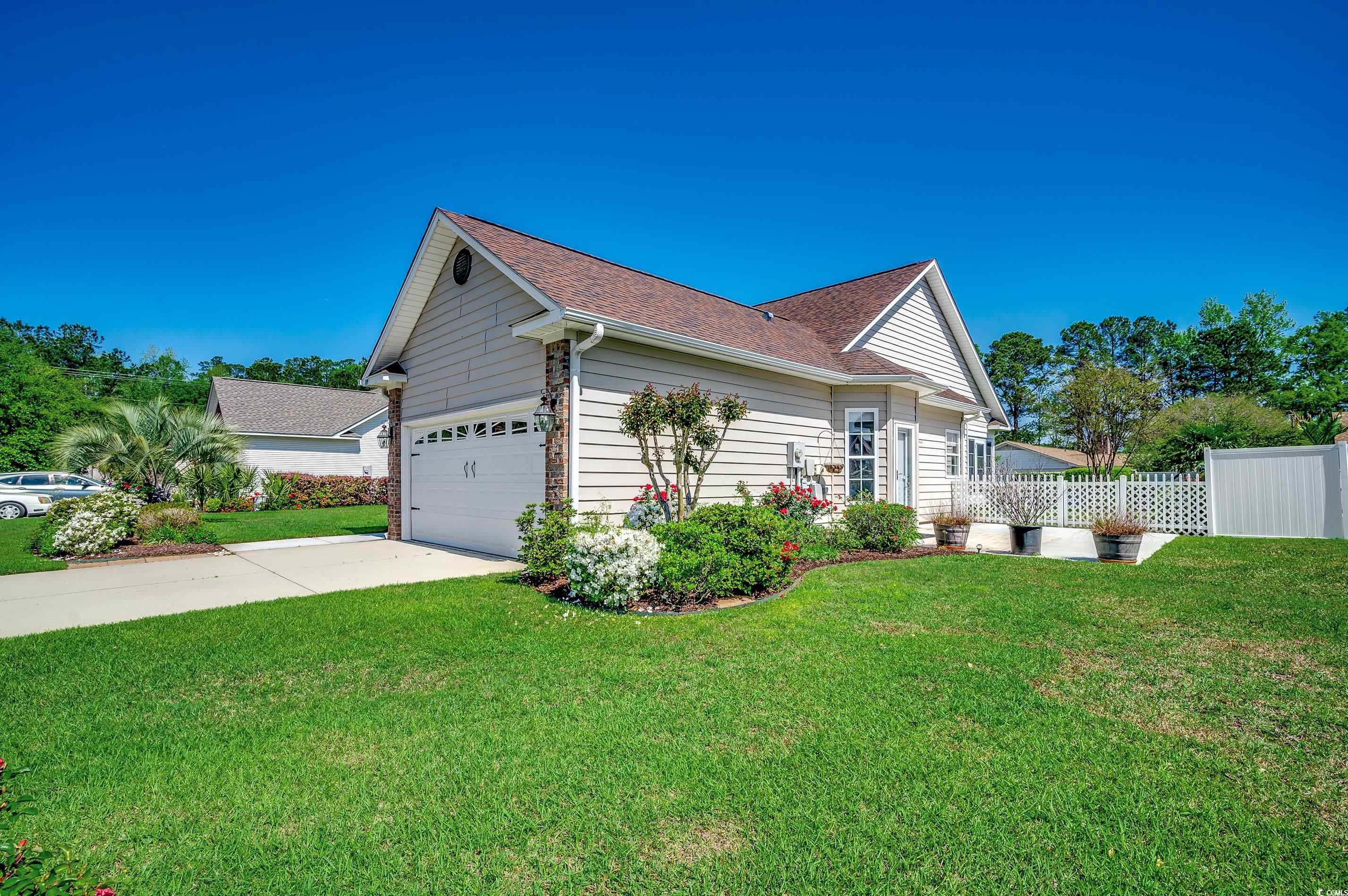 109 Pheasant Run Drive Murrells Inlet, SC 29576 - Photo 30 of 31 View of home's exterior with concrete driveway, an
