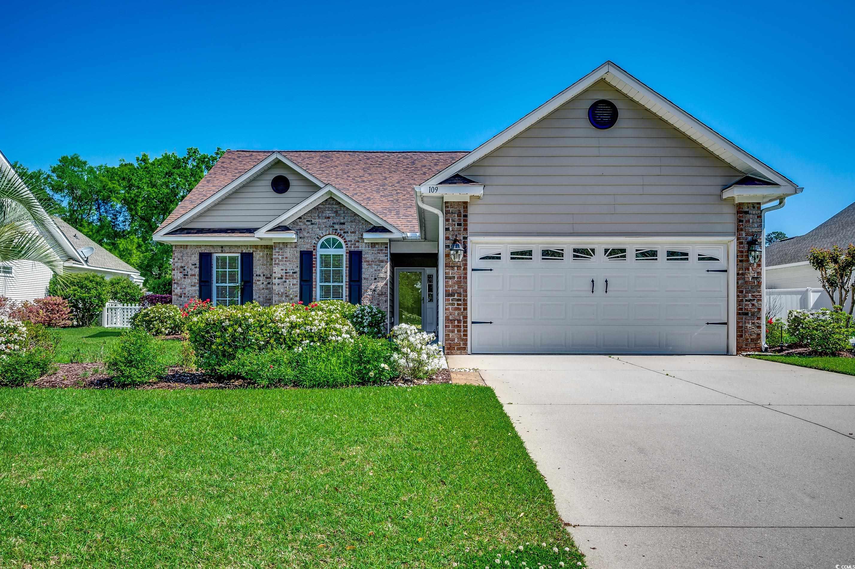 109 Pheasant Run Drive Murrells Inlet, SC 29576 - Photo 31 of 31 View of front facade with a garage, brick siding,