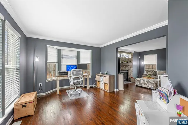 a view of a livingroom with furniture and hardwood floor