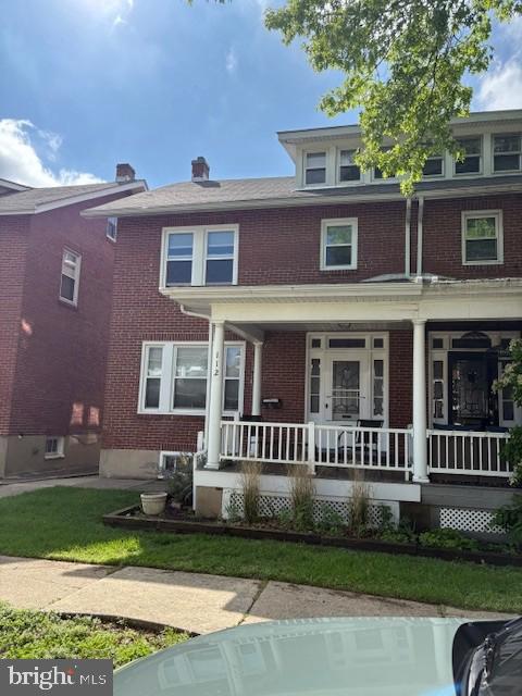 112 North Miller Street, Unit 2 Reading, PA 19607 - Photo 2 of 24 a front view of a house with a yard