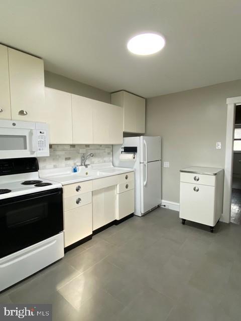 112 North Miller Street, Unit 2 Reading, PA 19607 - Photo 5 of 24 a kitchen with cabinets and white appliances
