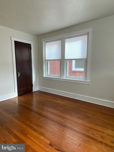 112 North Miller Street, Unit 2 Reading, PA 19607 - Photo 7 of 24 a view of an empty room with wooden floor and a window