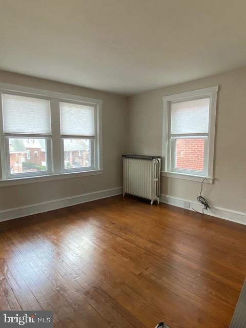112 North Miller Street, Unit 2 Reading, PA 19607 - Photo 8 of 24 a view of an empty room with wooden floor and a window