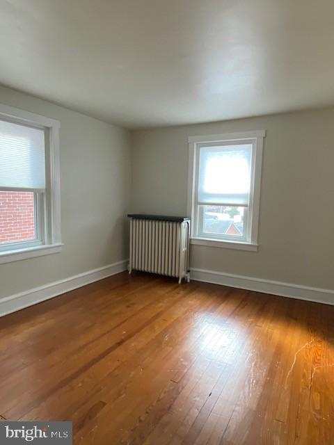112 North Miller Street, Unit 2 Reading, PA 19607 - Photo 10 of 24 an empty room with wooden floor and windows