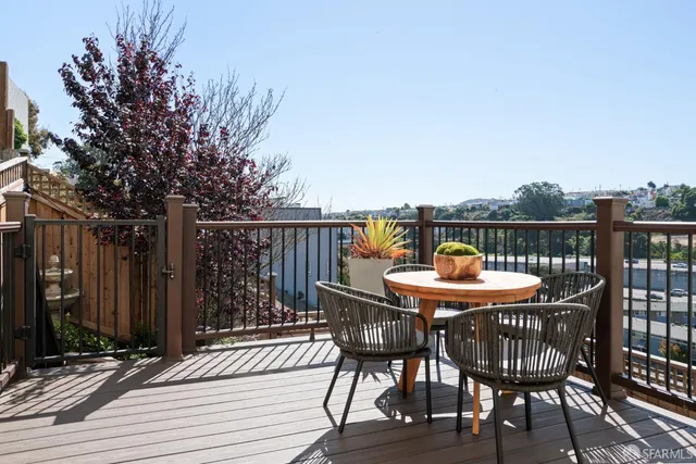 a outdoor living space with furniture and a rug