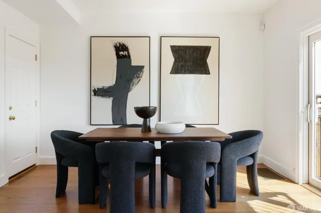 a view of a dining room with furniture and window