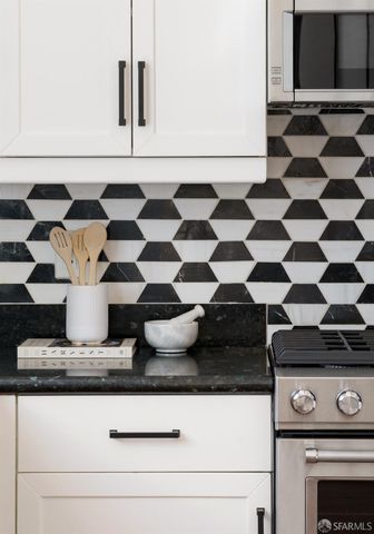 a close view of a stove a microwave and cabinets