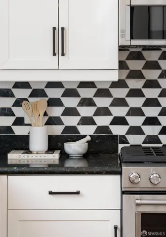 a close view of a stove a microwave and cabinets