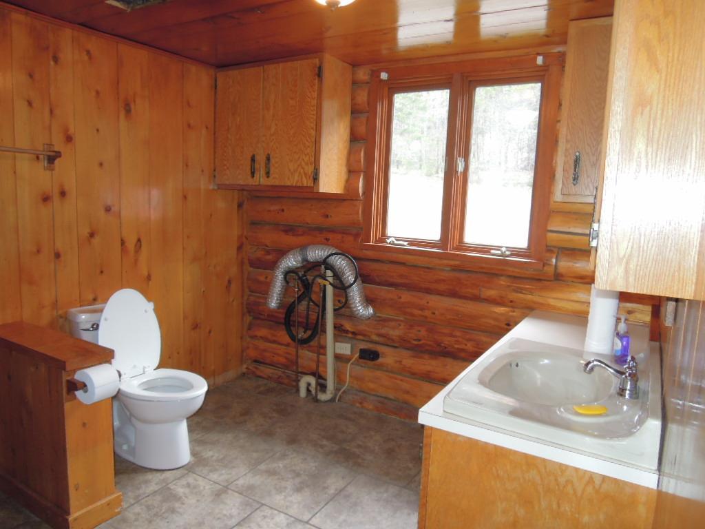 260 Station Road New Sweden, ME 04762 - Photo 15 of 34 First Floor Bath with W/D Hookup.