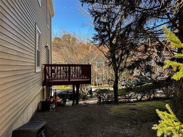 a front view of a house with yard and seating space