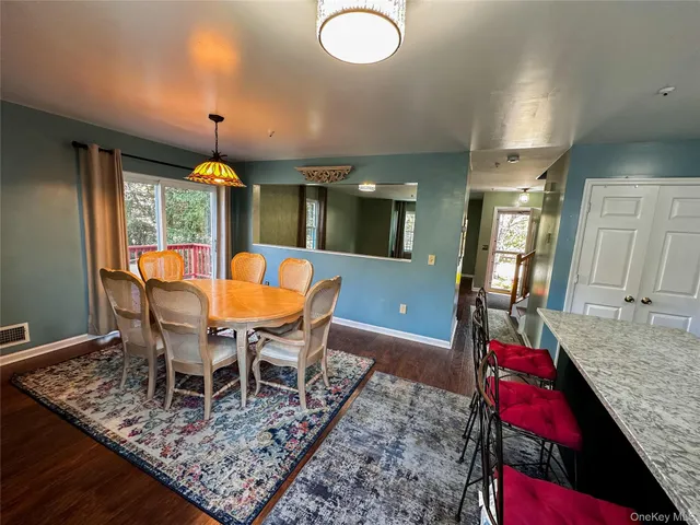 a view of a dining room with furniture