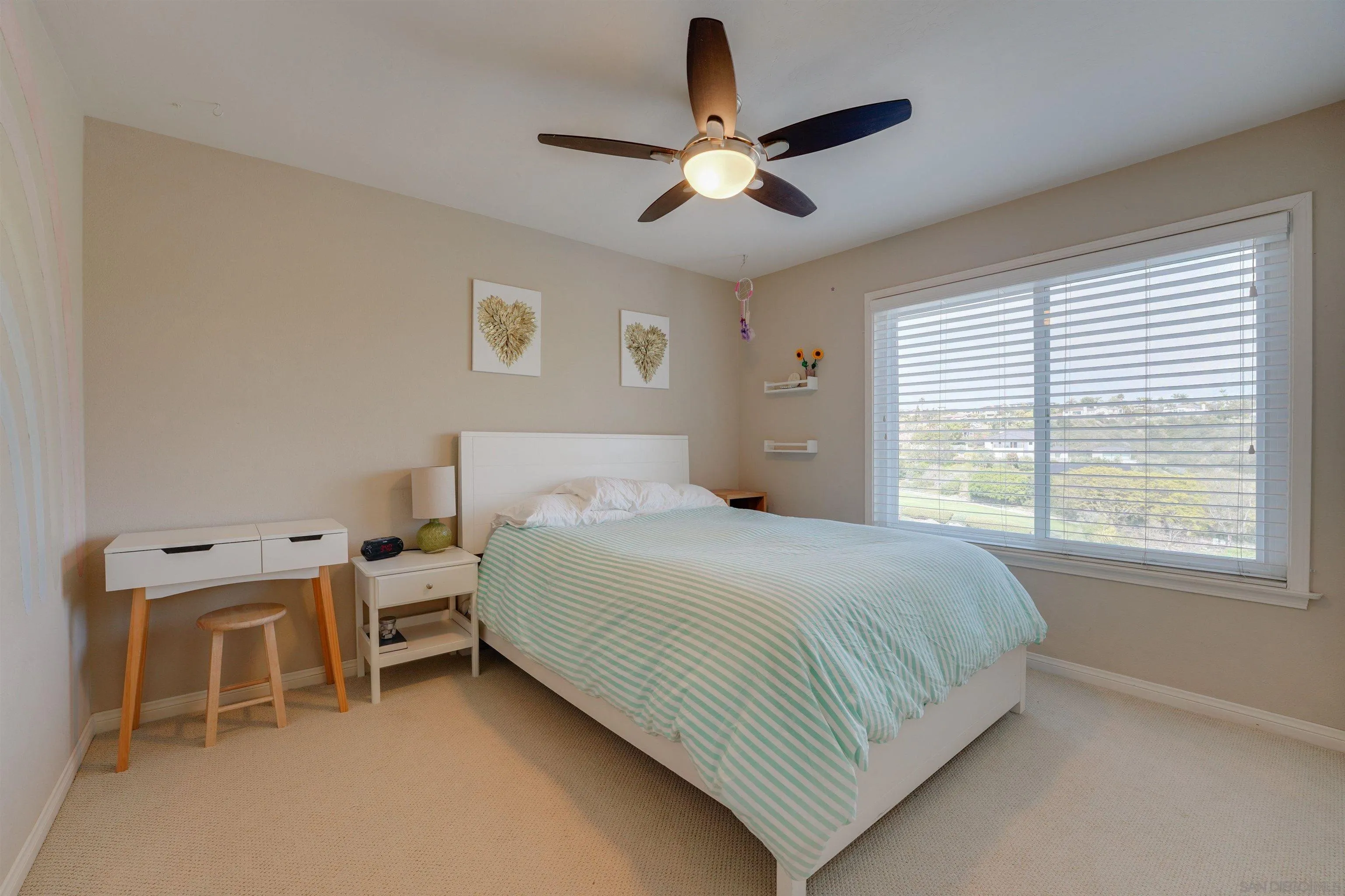 1647 Hawk View Drive Encinitas, CA 92024 - Photo 26 of 73 a bedroom with a bed and a large window